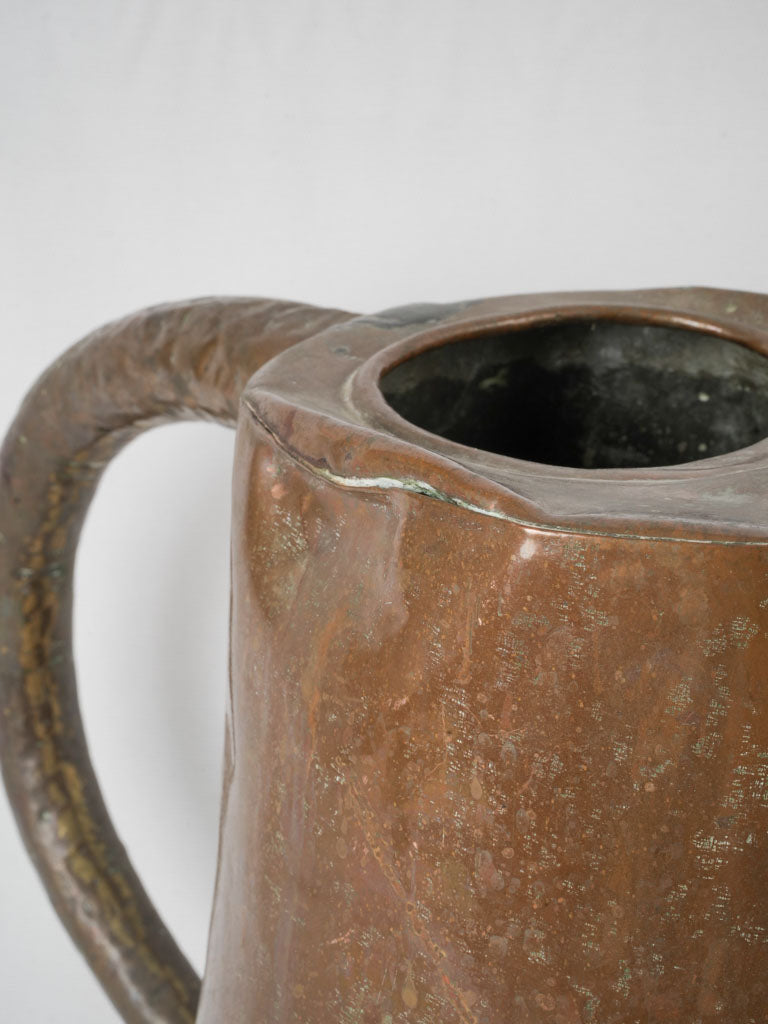 Authentic, rustic copper watering can