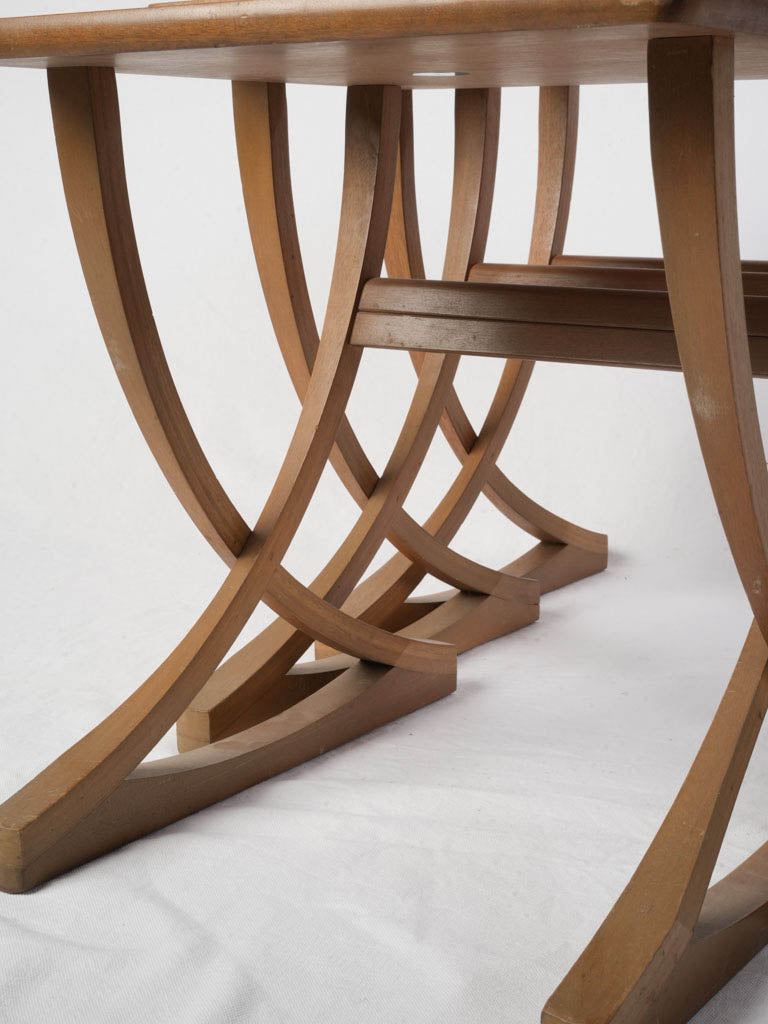 Sculptural arched trestle base tables