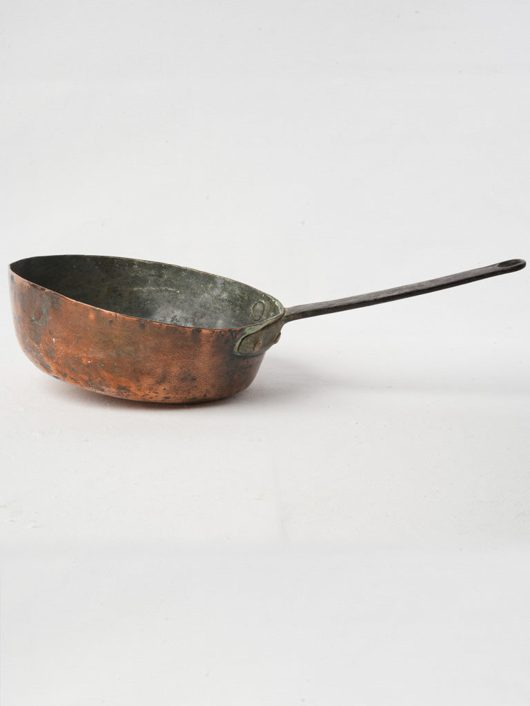 Elegant aged copper saucepan