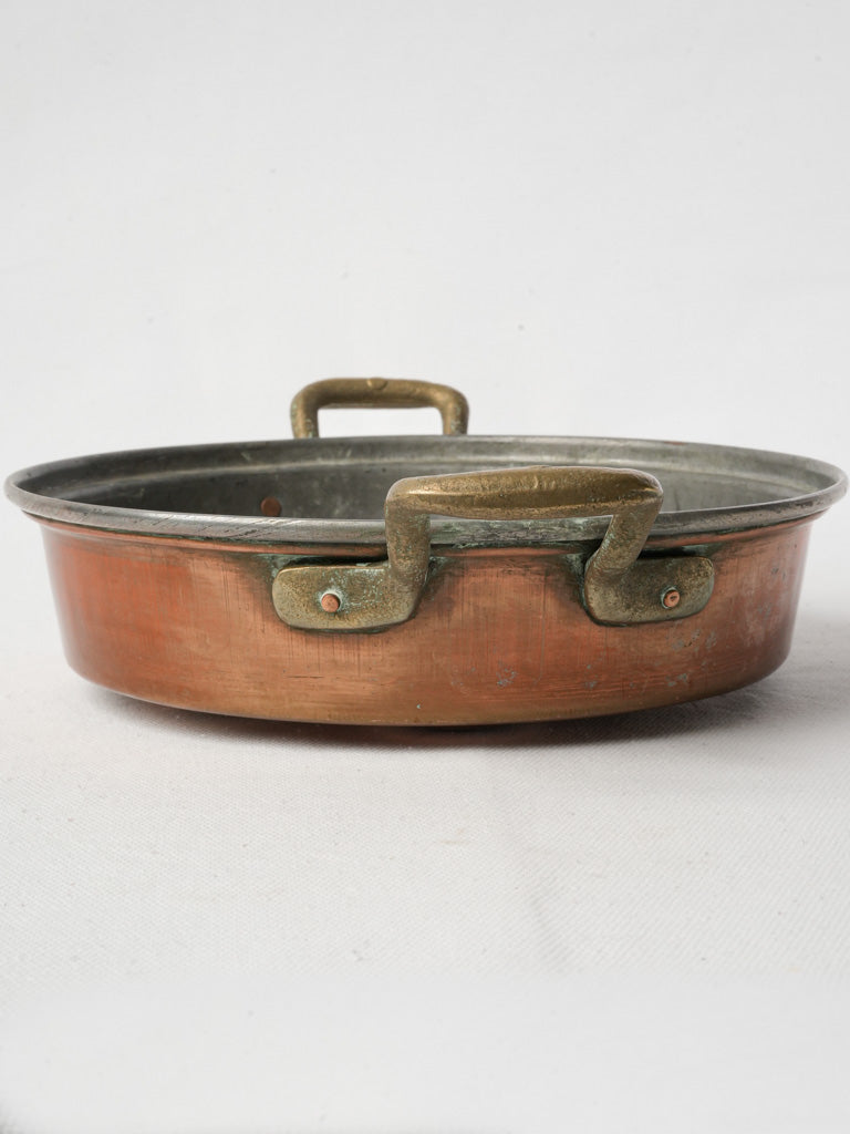 Rustic tin-lined culinary tool  