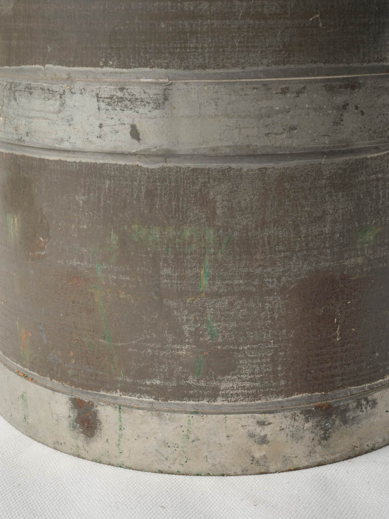 Patina-worn industrial vintage churn