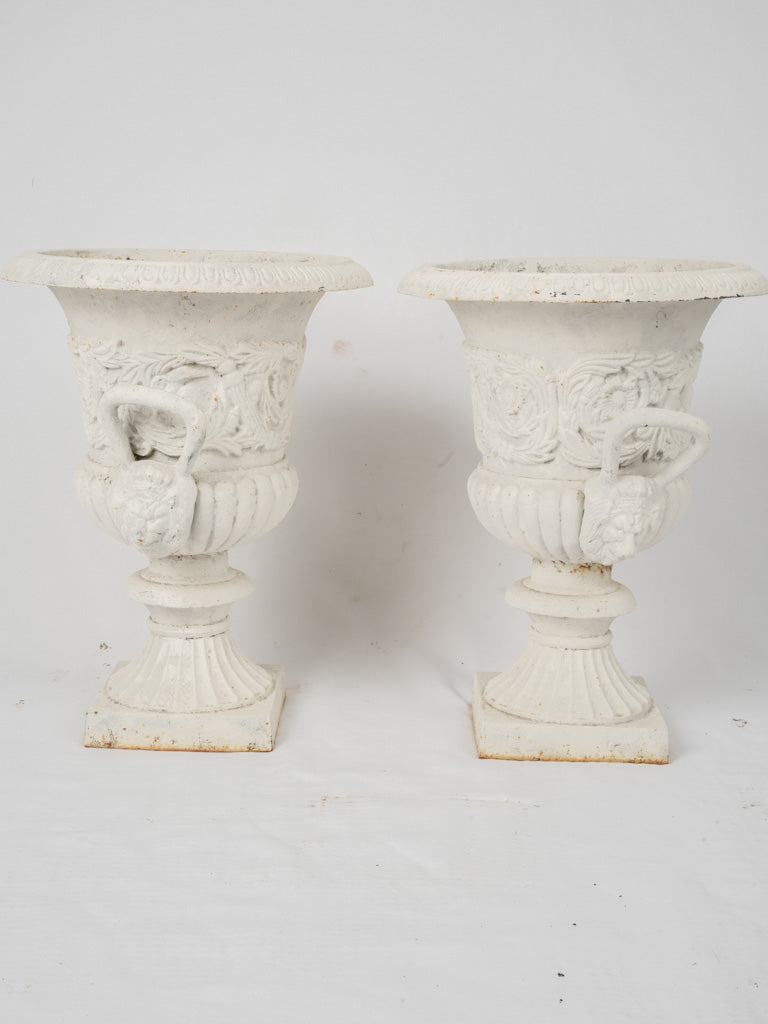 Distressed painted decorative urn pair