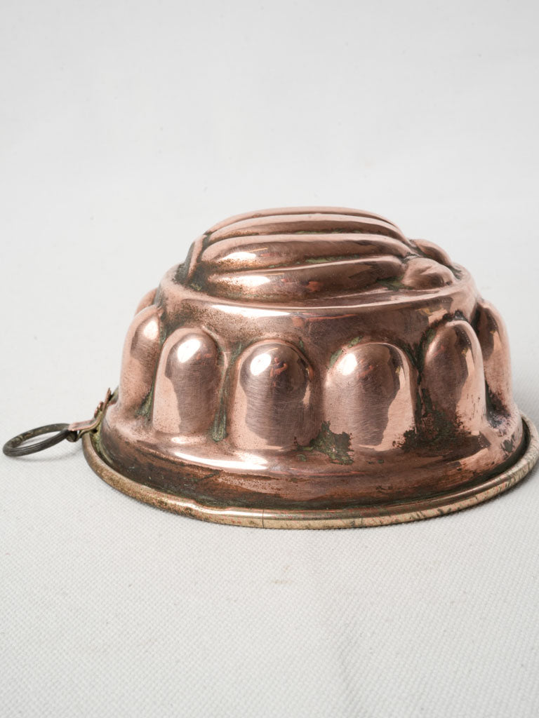 Intricate gadrooned copper display mold  