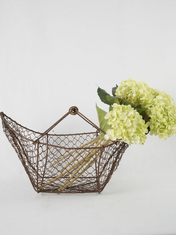 Timeless, weathered wooden handle harvest basket
