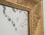 Time-honored giltwood mirror with patina