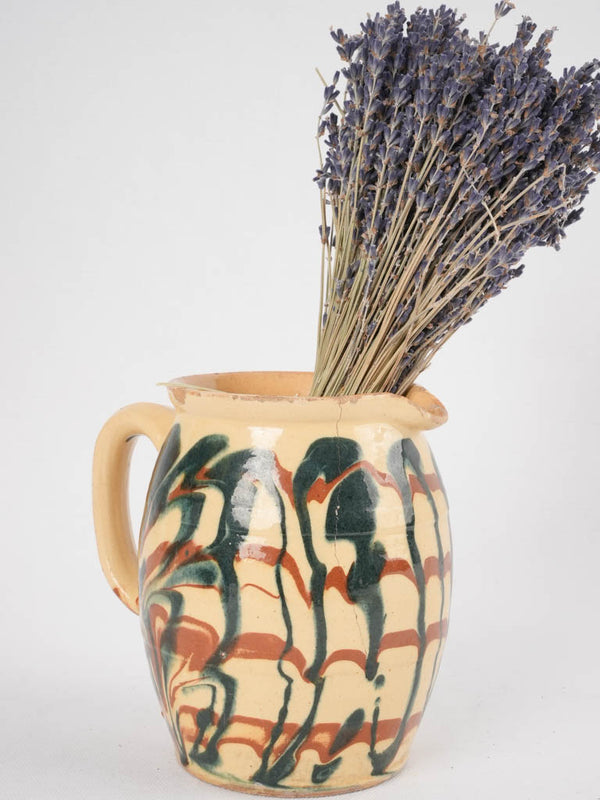 Vintage yellow-base glaze earthenware jug