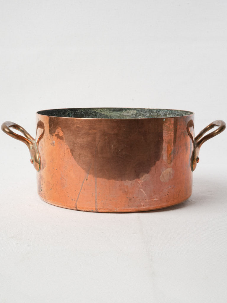 Aged copper saucepan with patina