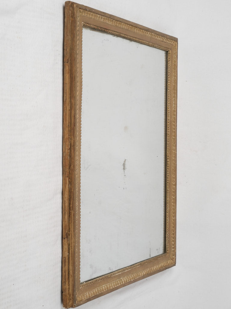Opulent pearling antique French mirror