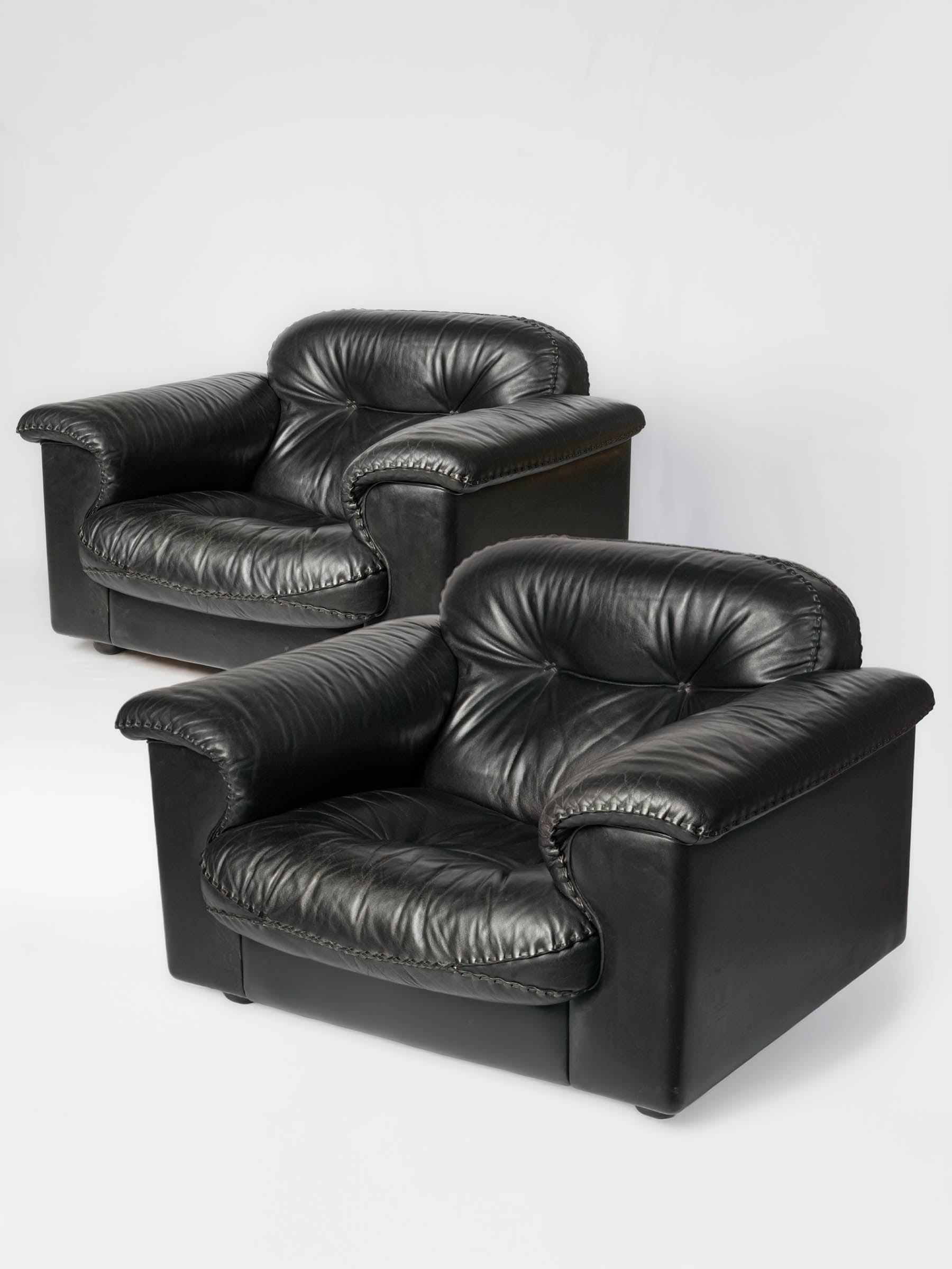 Vintage supple black leather armchairs  
