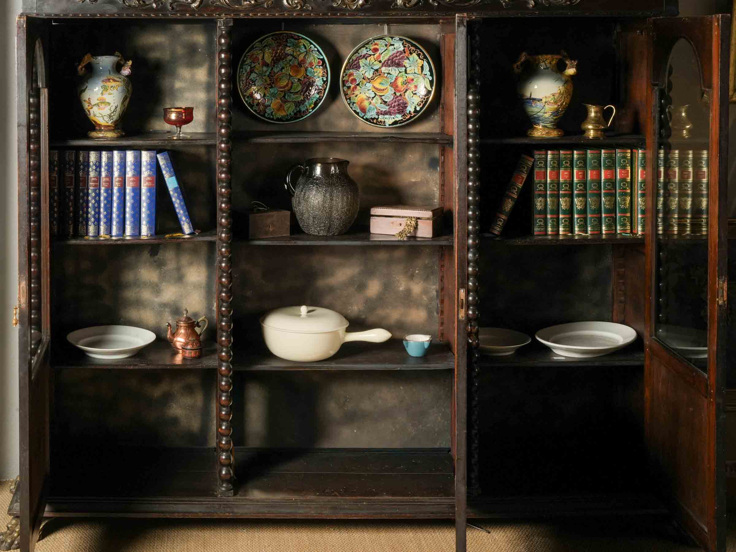 Gilt paint accented bookcase
