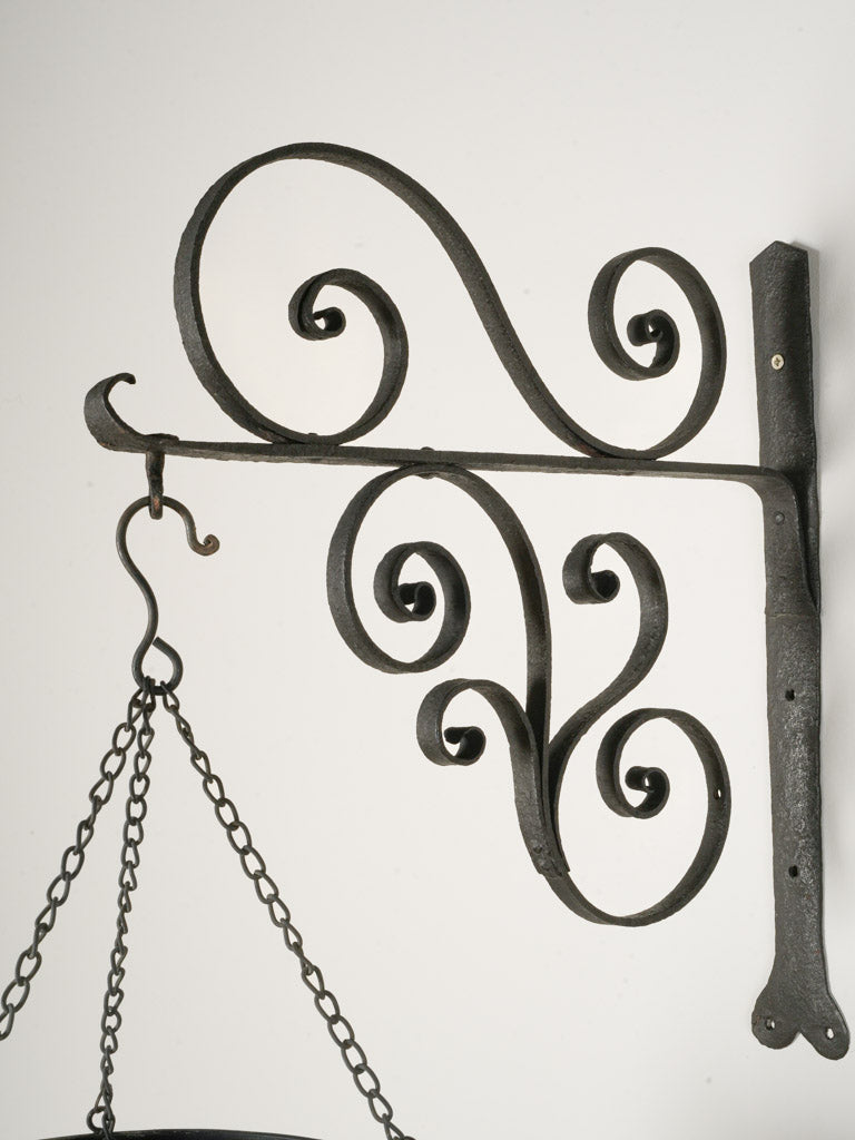 Softly patinaed wrought iron bracket  