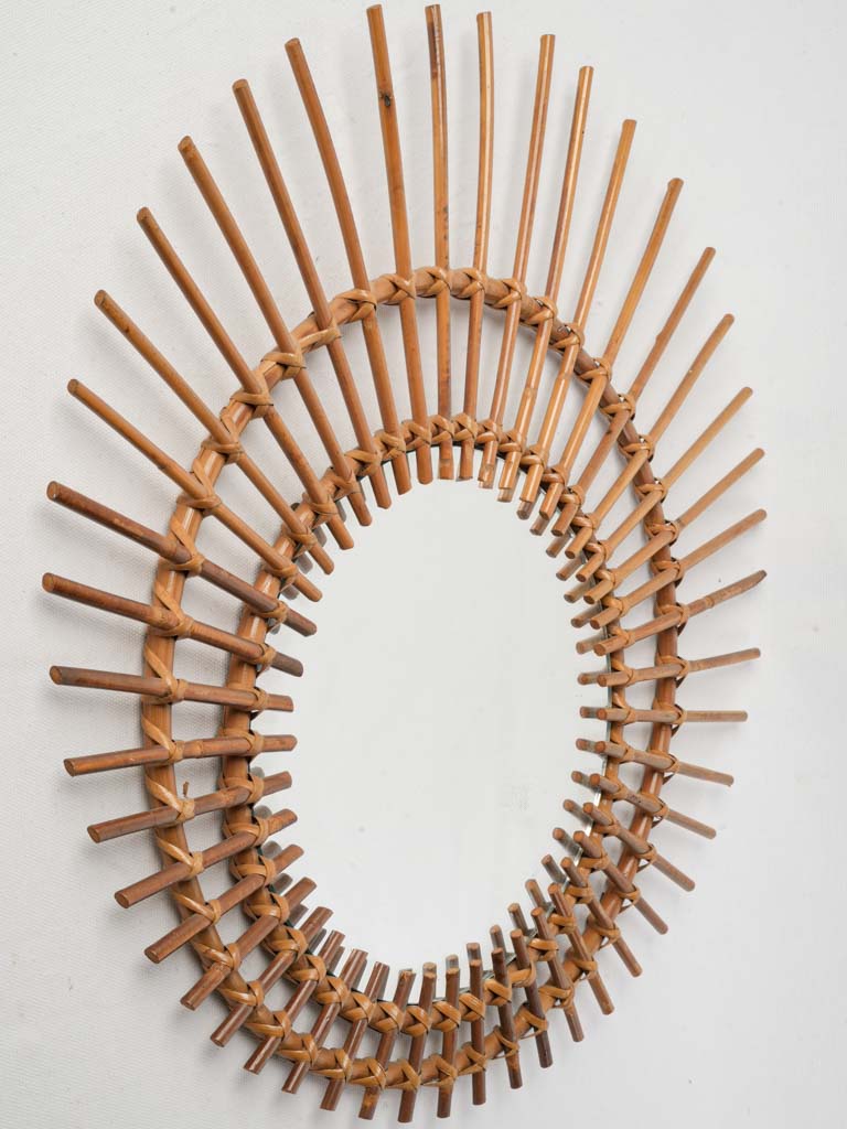 Vintage 1960s sunburst rattan mirror