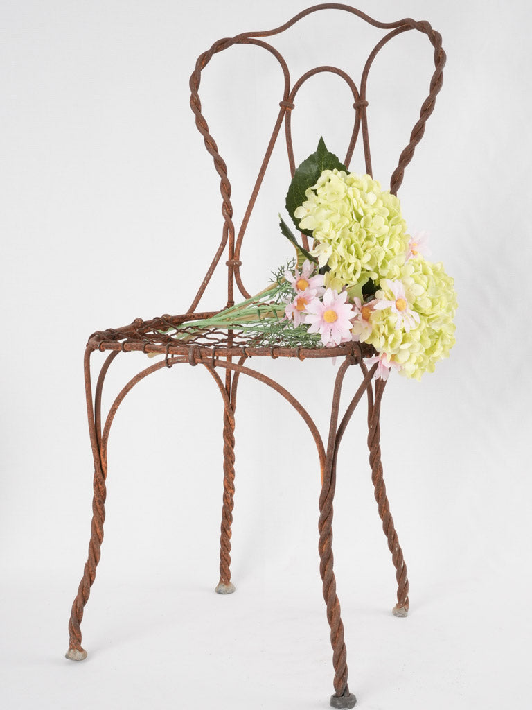 Antique twisted iron garden chair