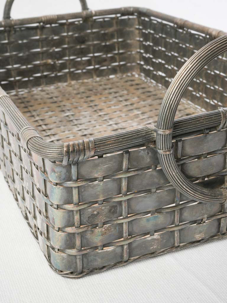 Artisanal silvered metal woven tray.