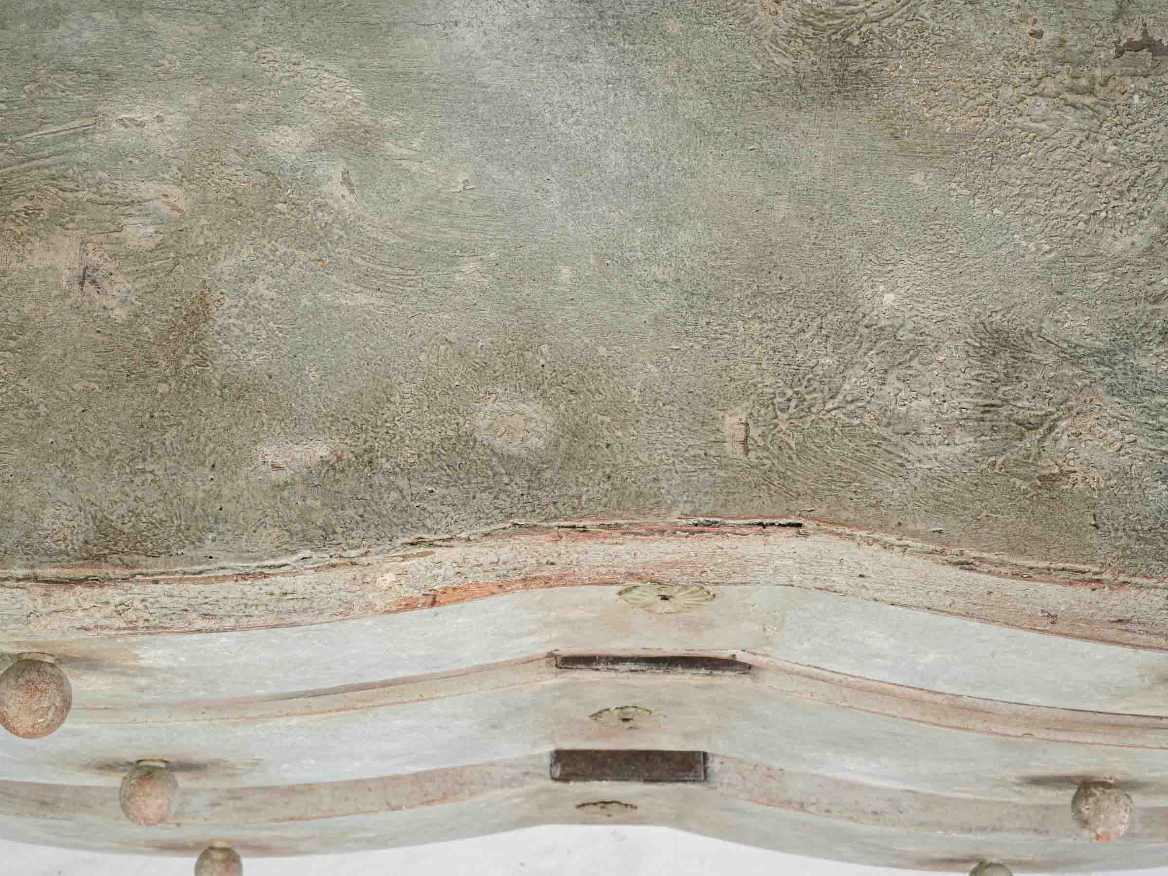 Understated patina-finished Mazarine commode