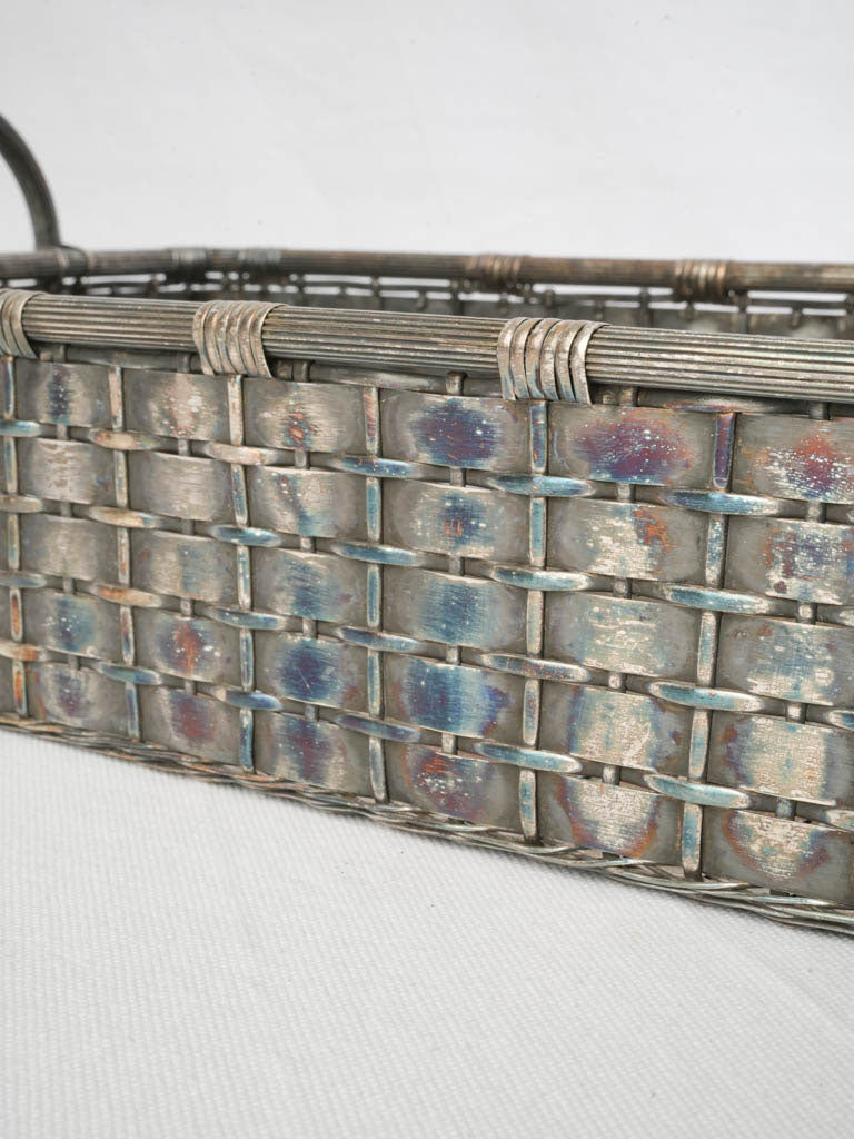 Distinctive interlaced metalwork basket.