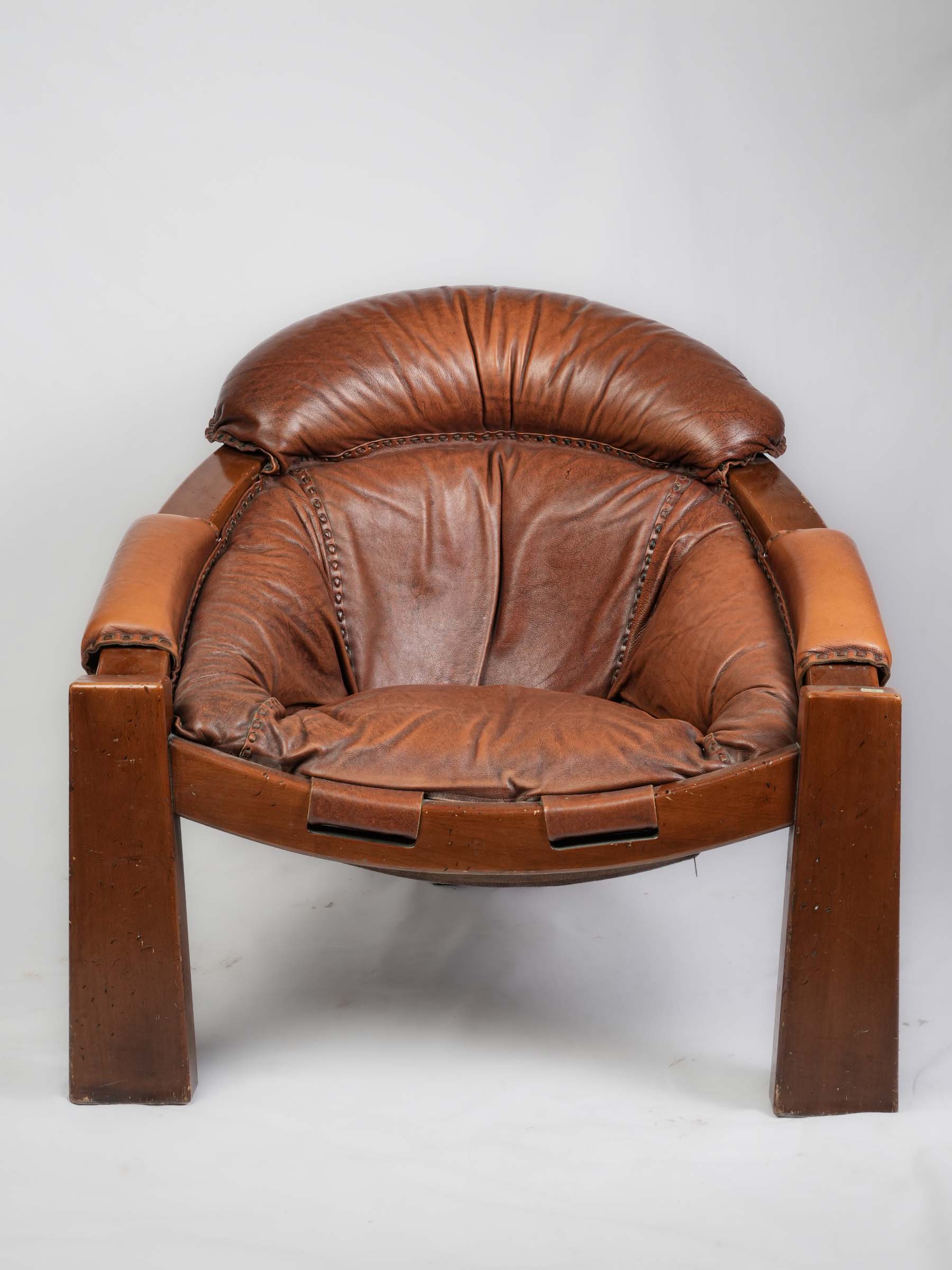 Sculptural 1970s cognac armchair  