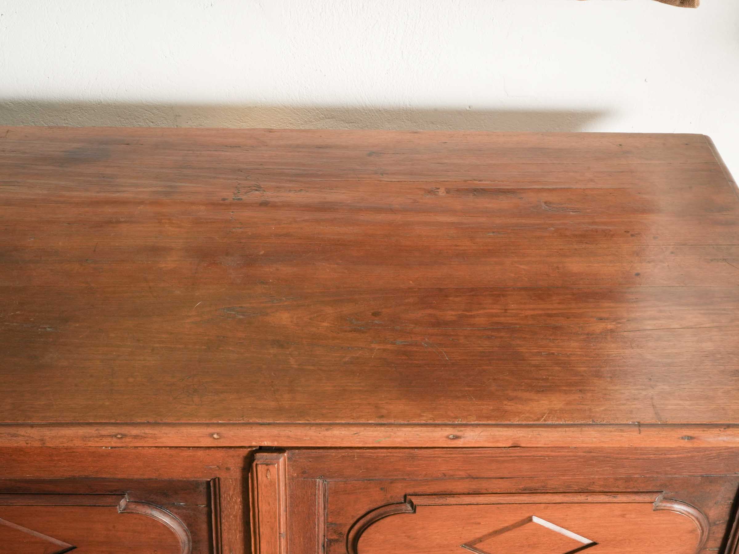 Elegant sculptural walnut cabinet