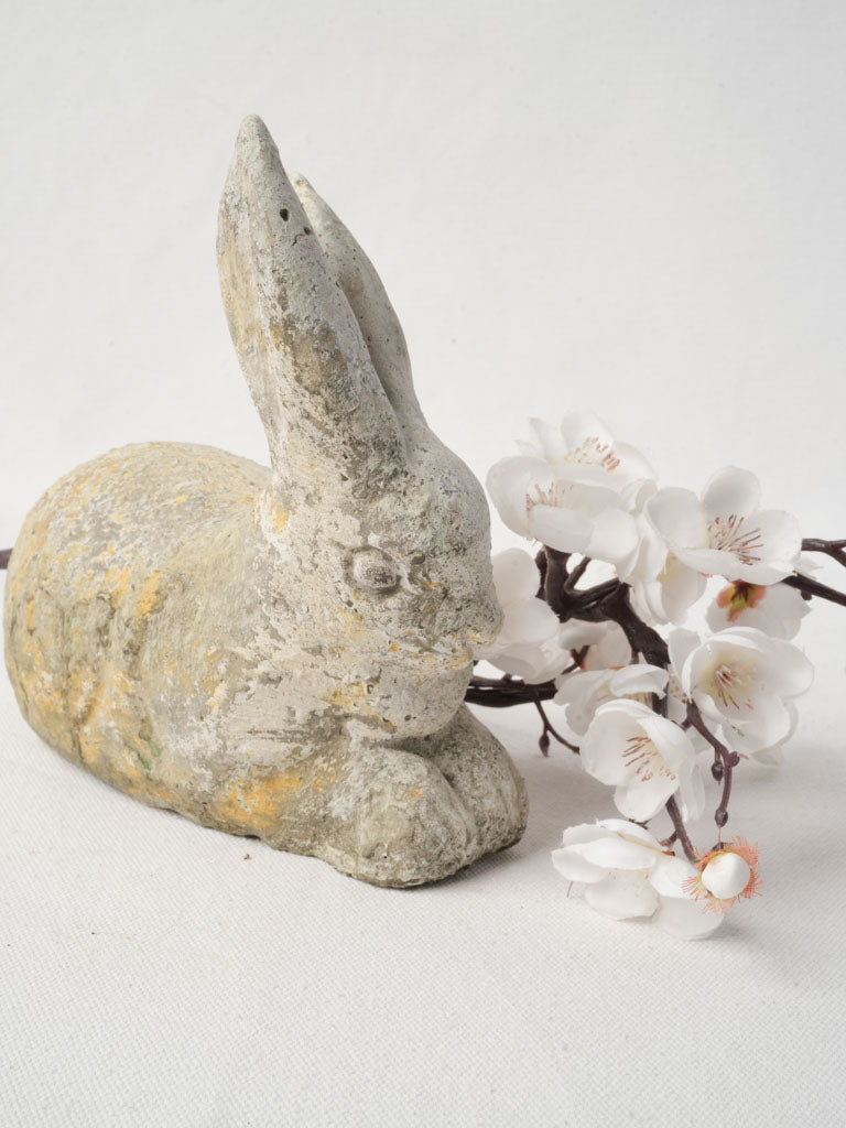 Endearing rustic garden rabbit statue  