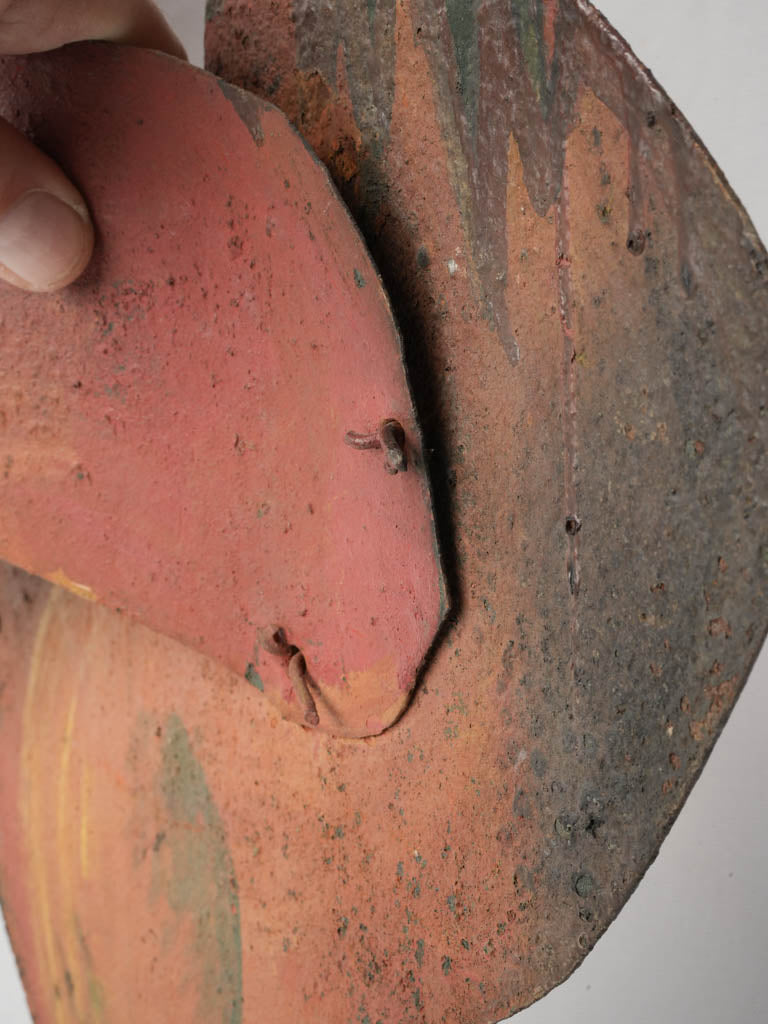 Sculptural relief rooster emblem