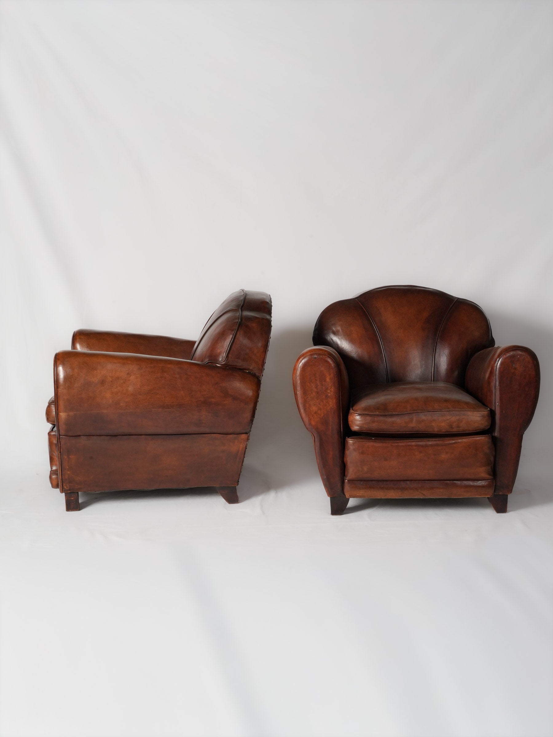Art Deco armchairs aged leather finish