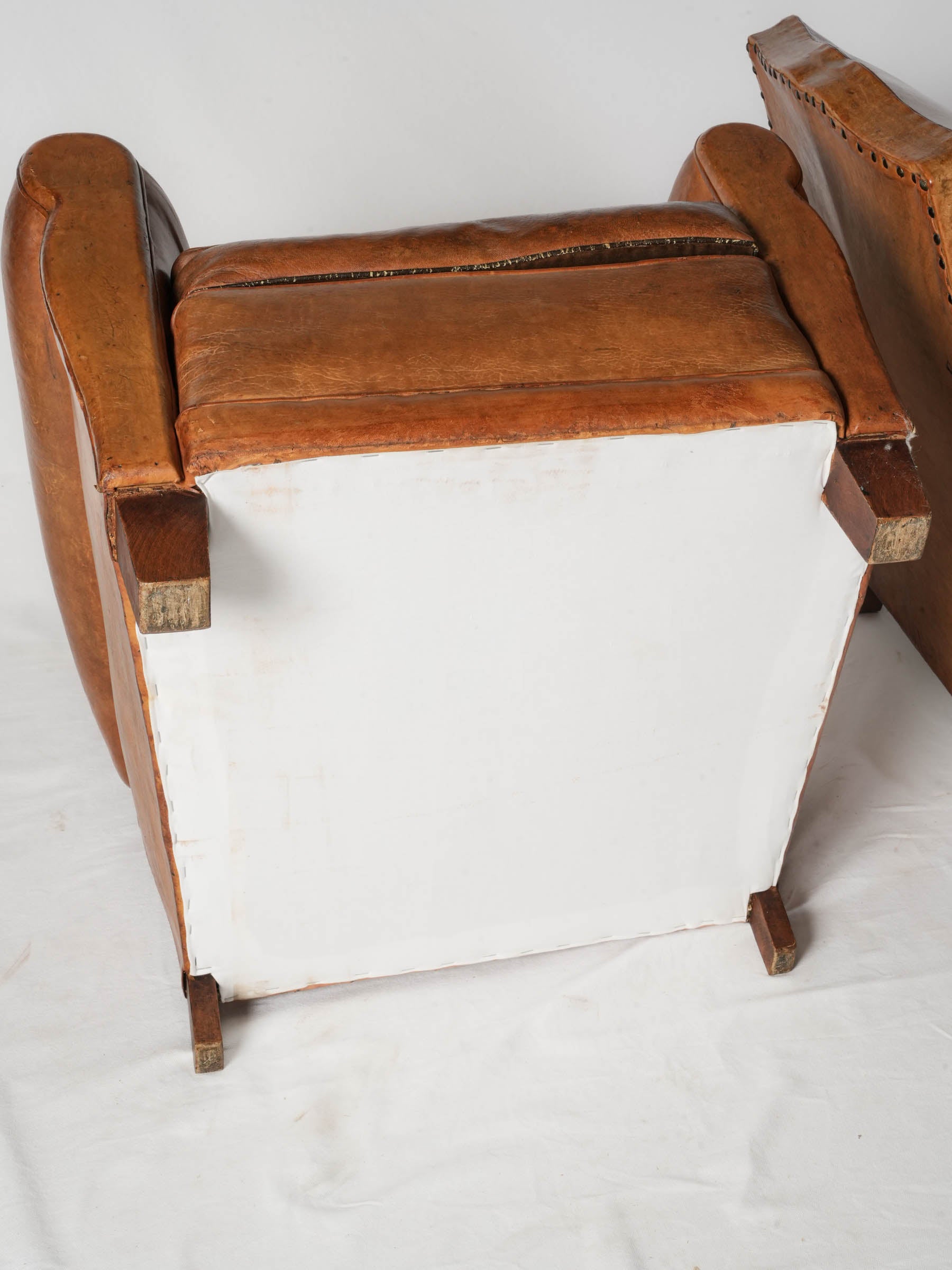 Inviting brass-accented club chairs