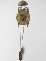 Antique bronze-finish Louis XIV clock