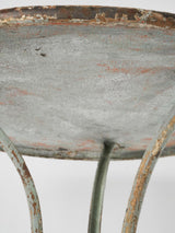 Antique, weathered paw-foot outdoor table