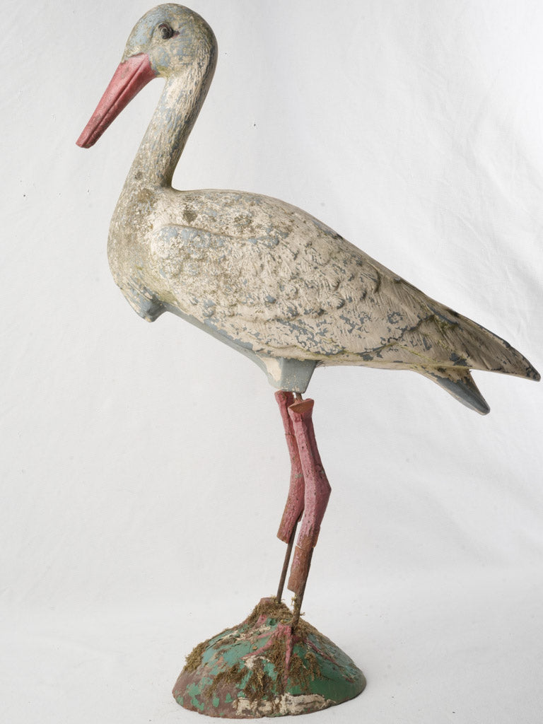Weathered polychrome stork decoration  