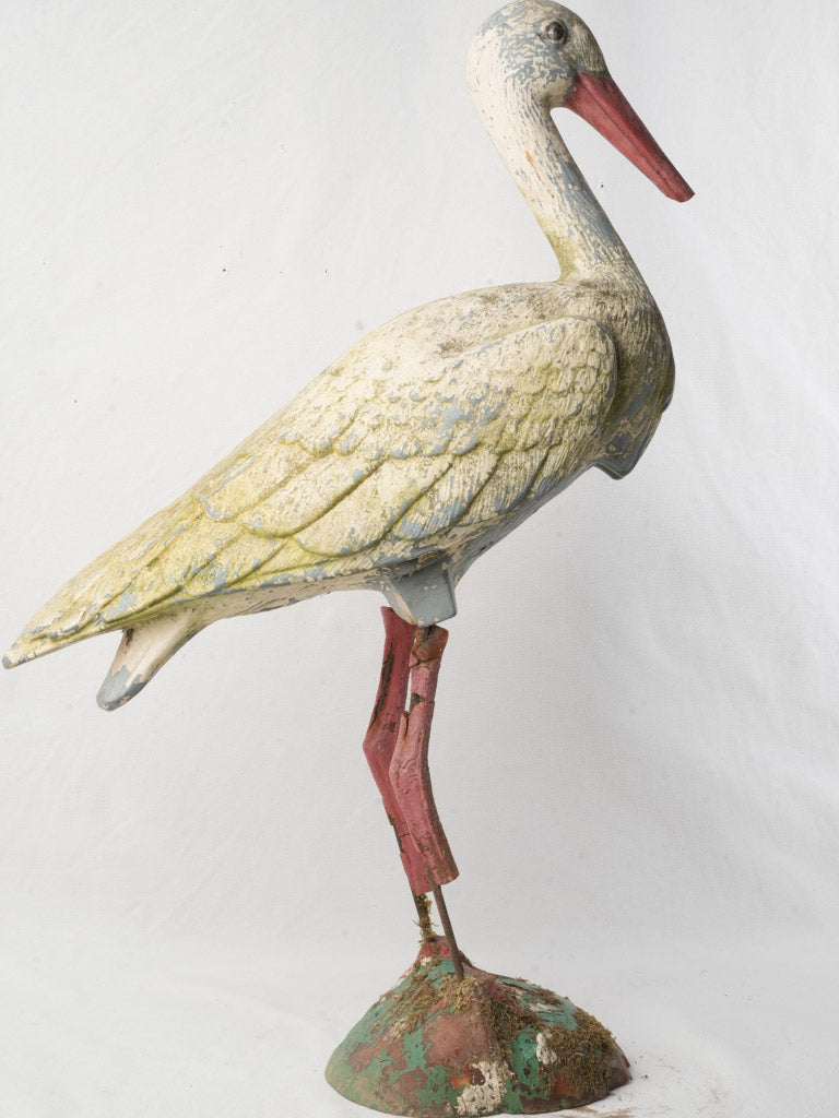 Charming moss-accented bird sculpture  