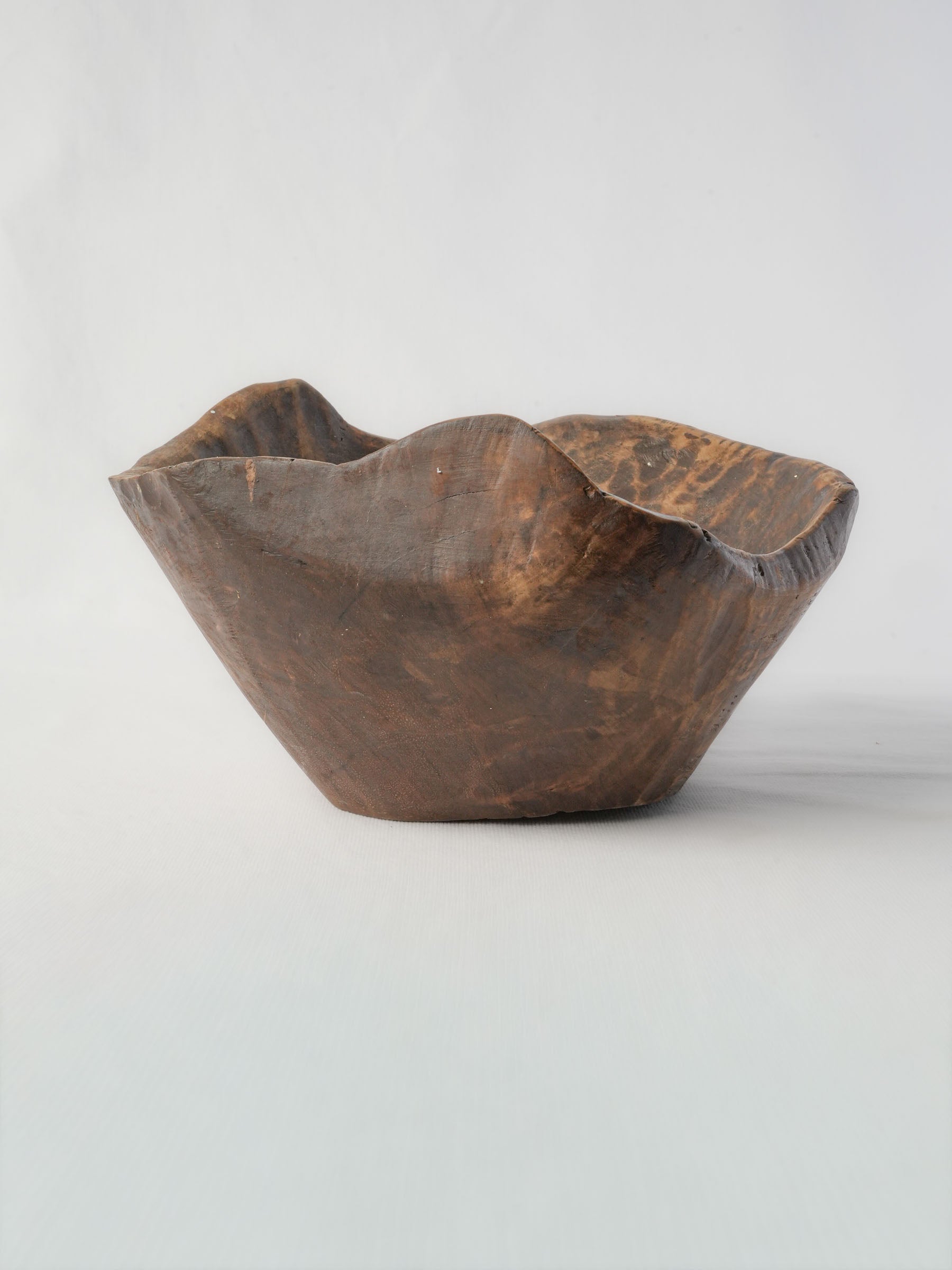 Asymmetrical patina-rich dining bowl