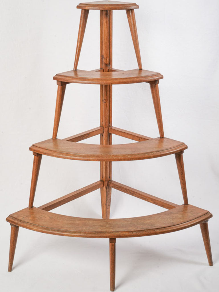 Warm honey-brown crescent shelf display  