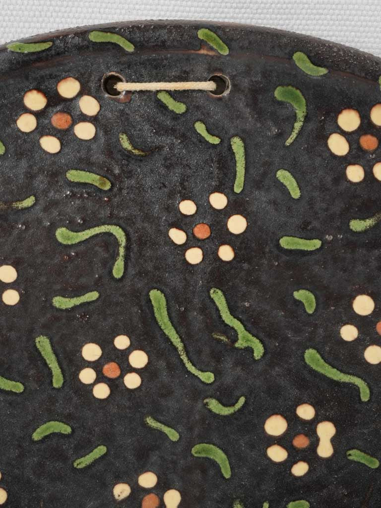 Hand-decorated pottery wall decor
