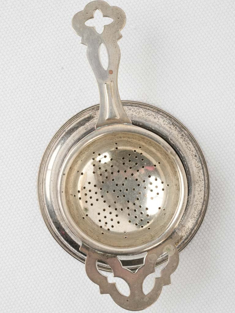 Polished antique English tea strainer