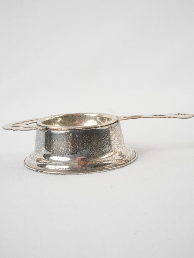 Timeless silver tea strainer