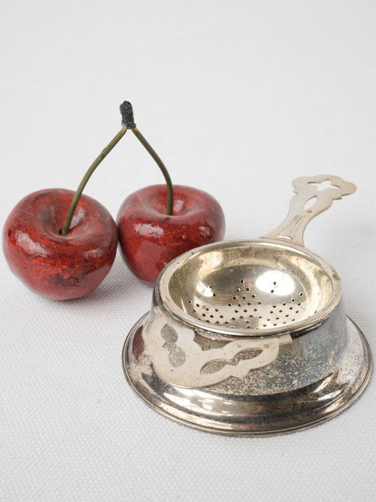 Elegant oxidized English tea strainer