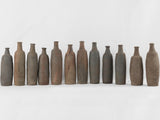 Collection of 12 terracotta long bottles from Normandy 11¾"