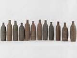 Aged terracotta long-necked decorative bottles