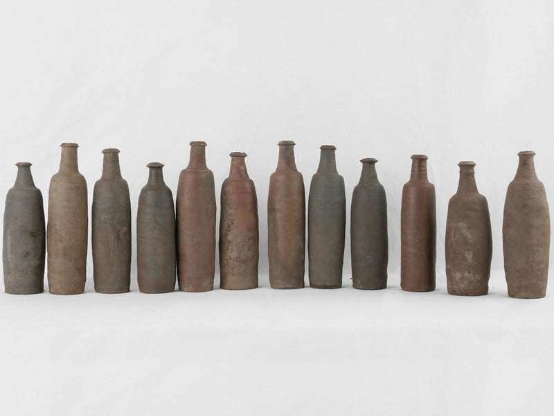 Aged terracotta long-necked decorative bottles