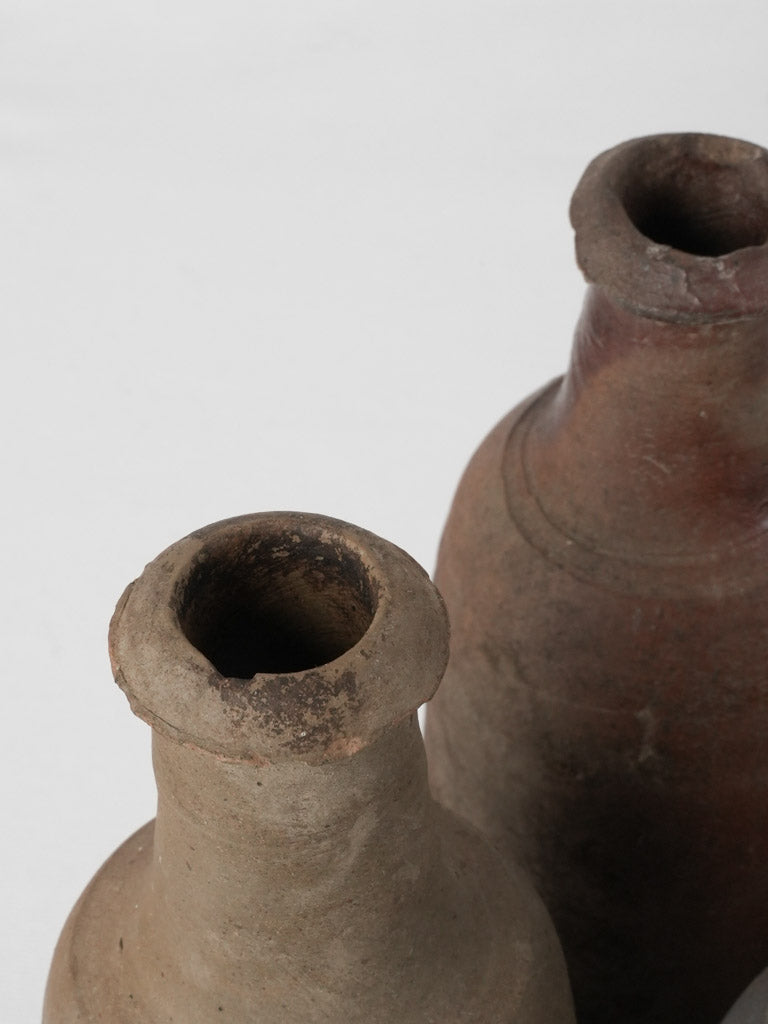 Collection of 12 terracotta long bottles from Normandy 11¾"