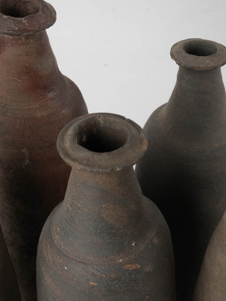 Collection of 12 terracotta long bottles from Normandy 11¾"