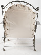 Historic removable-cushion iron armchair