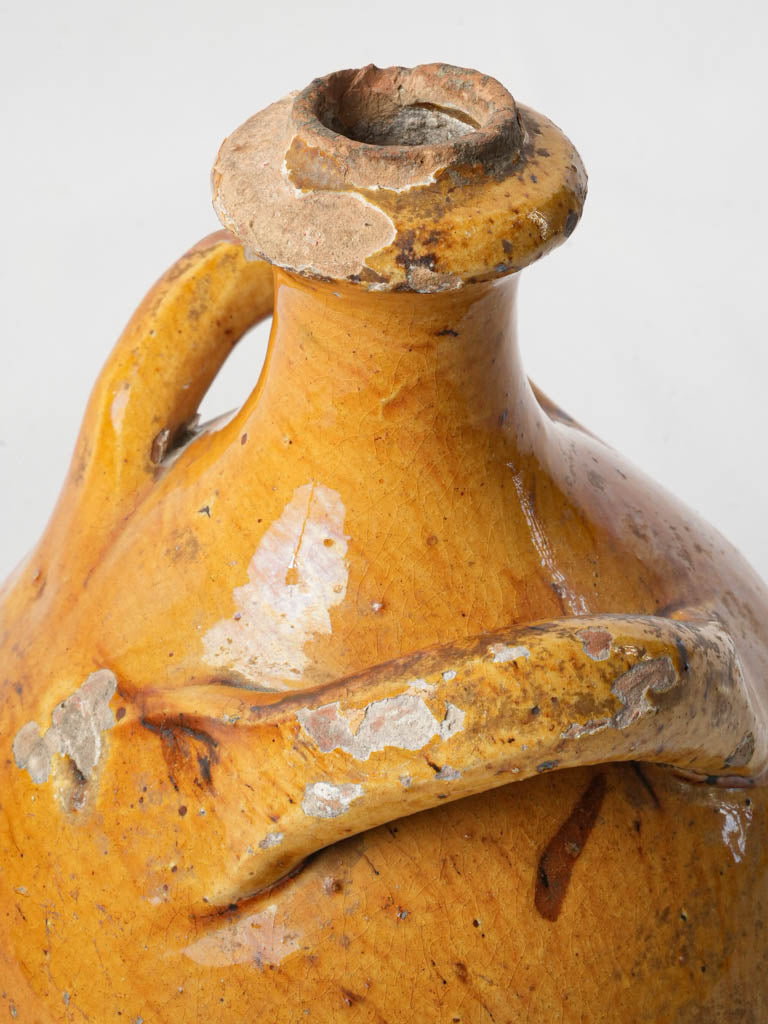 Worn rustic ecclesiastical oil jug  