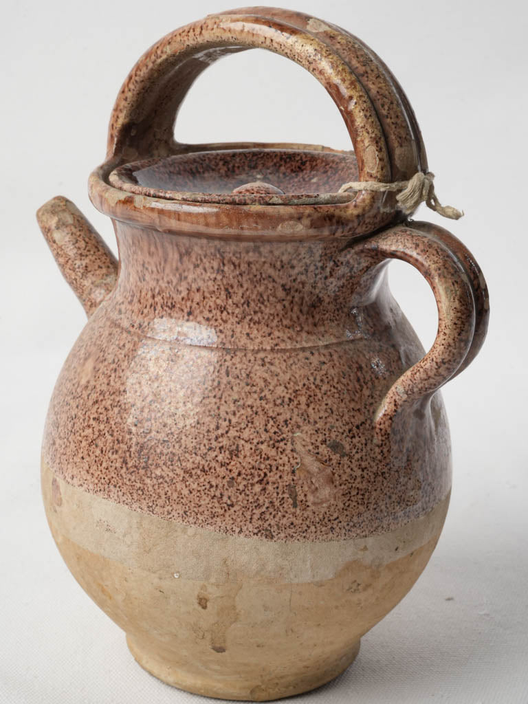 Ornate elongated spout liquid container  