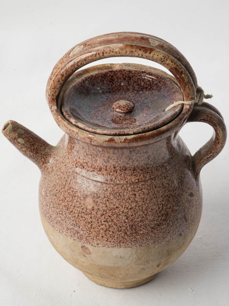 Preserved buff-colored clay carafe  