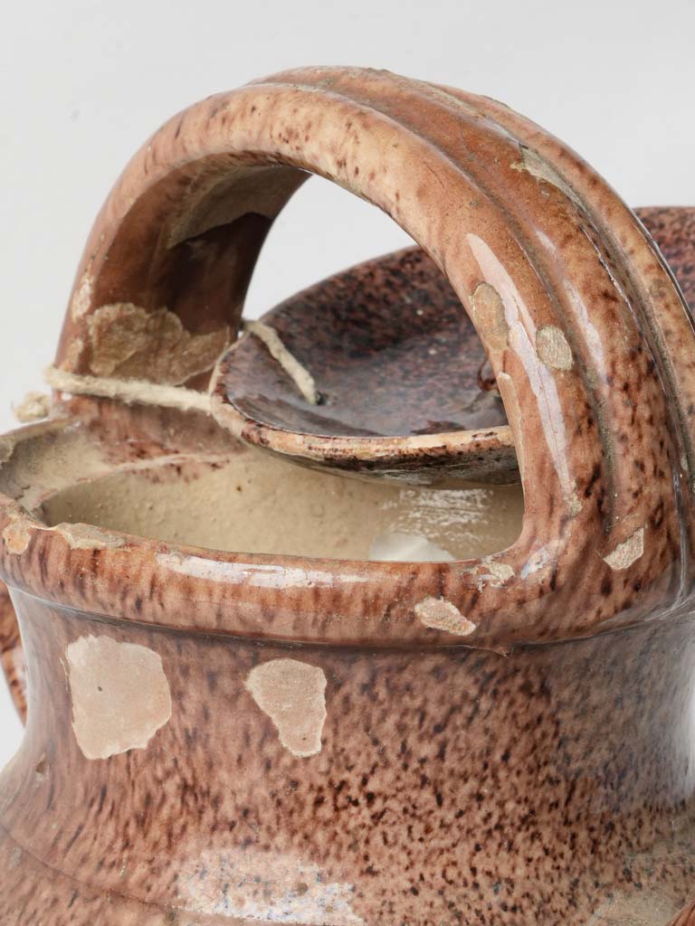 Uncommon handle design pottery piece  