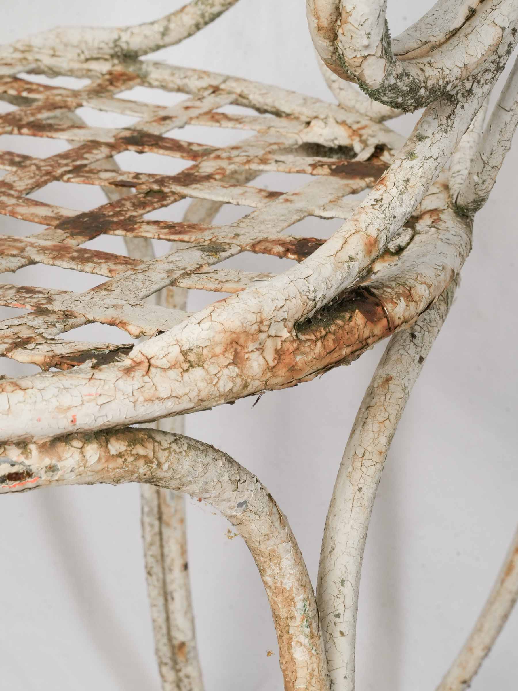 Scrolled ironwork French armchairs  