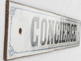 Classic blue black-text Concierge signage