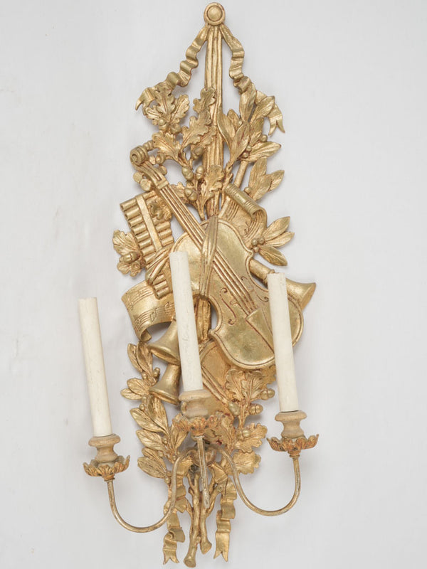 Gilded antique music-themed wooden sconce