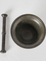 Unique bronze pestle with patina